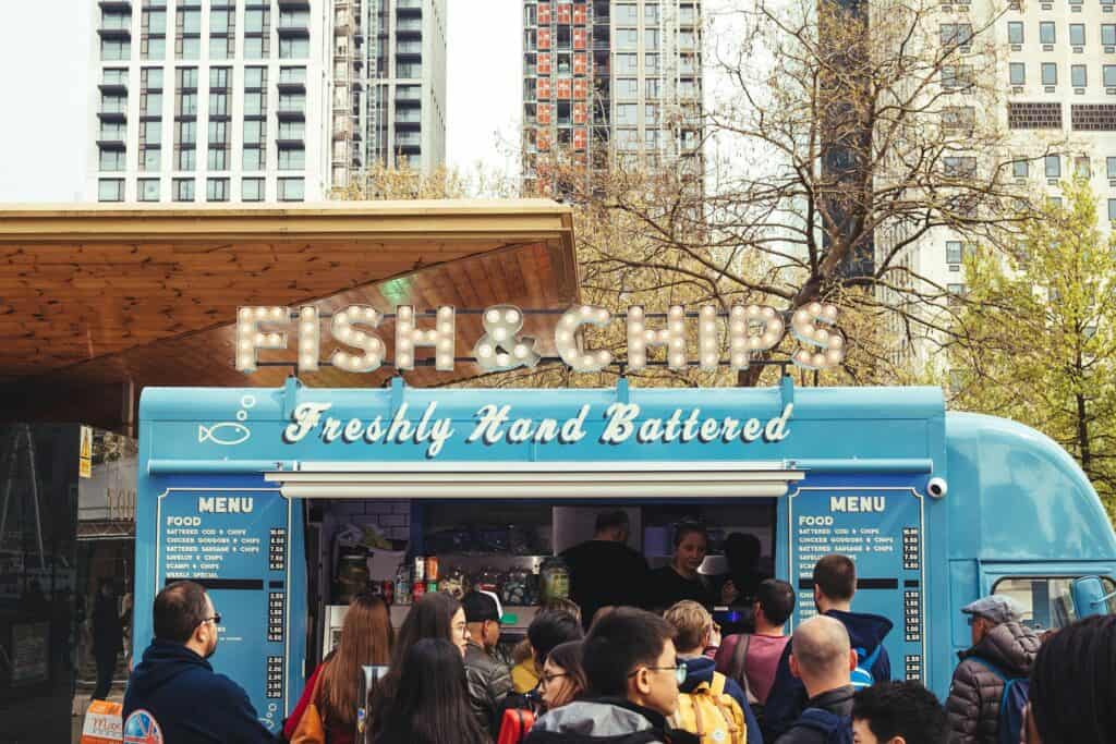 Customers gathered around a busy food truck, a look at whether food trucks are profitable