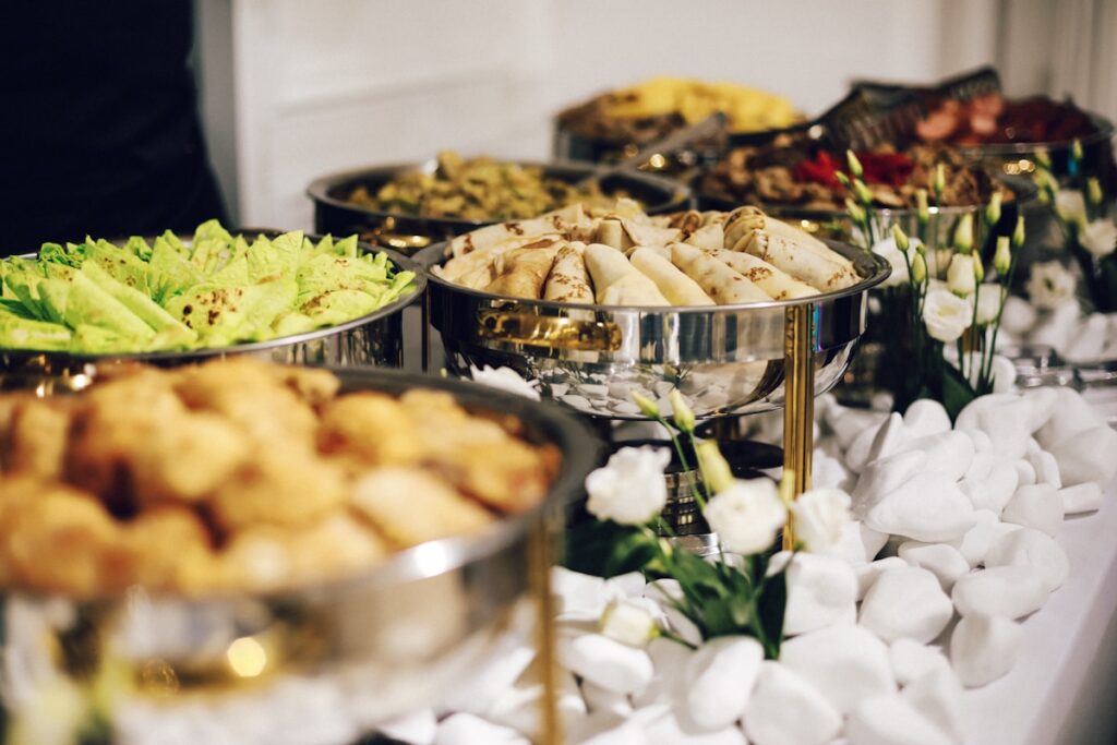 how to start a catering business - catering staff serving food at an outdoor event