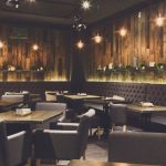 Cozy wooden restaurant dining room ready for service
