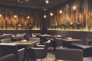 Cozy wooden restaurant dining room ready for service