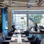 Modern restaurant interior with set tables
